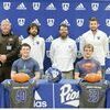 Xander Spears and Riley McCurry (seated) are pictured during a signing ceremony held at Thomas Walker High School with the duo inking with Bluefield University. Pictured with them are coaches (left to right) Tim Deel, Tyler Hall, Tanner Hall, and Joshua Perry.