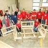 Students in Carpentry II and III classes at Lee County Career and Technical Center received shirts as a gesture of thanks for their work in creating bed frames for Sleep in Heavenly Peace. Pictured are, in front: Shaunda Bolinsky and Rachel Glass. Standing are: Dylan Zeisloft, Koda Honeycutt, Chastin Huff, Jan Harber and Vicki Young with Sleep in Heavenly Peace, Carpentry instructor Greg Rasnic,  Brandon Eldridge, J.R. Jarnigan, Devin Davidson, Gabe Snodgrass, Grant Howell, Cayden Staudinger, and Lance Maggard.