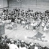 This photo of a Kaleidoscope performance by Lee and Thomas Walker band students was taken in the early years of the Fine Arts Festival with Caroline Kelly shown directing the combined bands.
